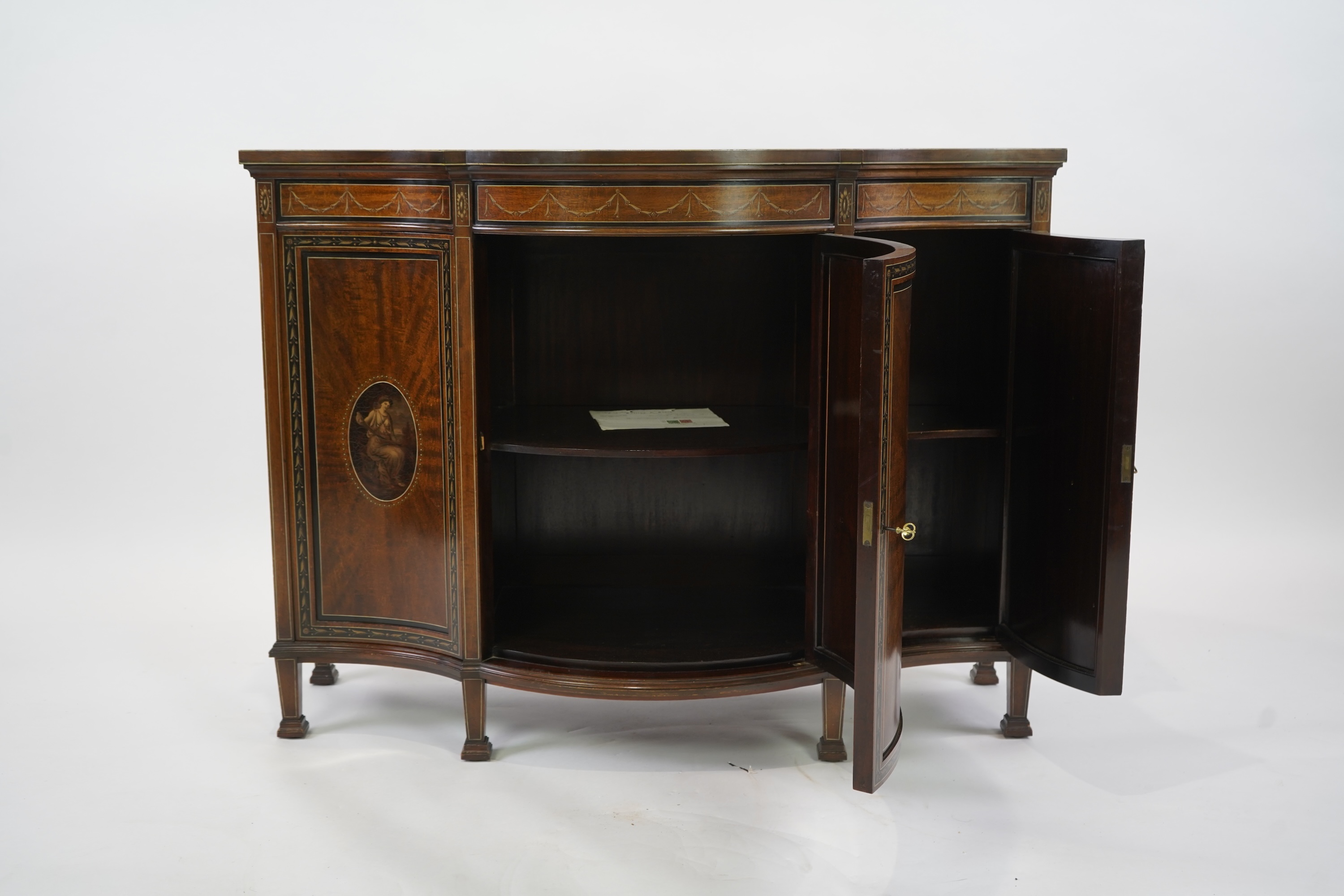 An Edwardian Sheraton Revival painted mahogany bowfront side cabinet